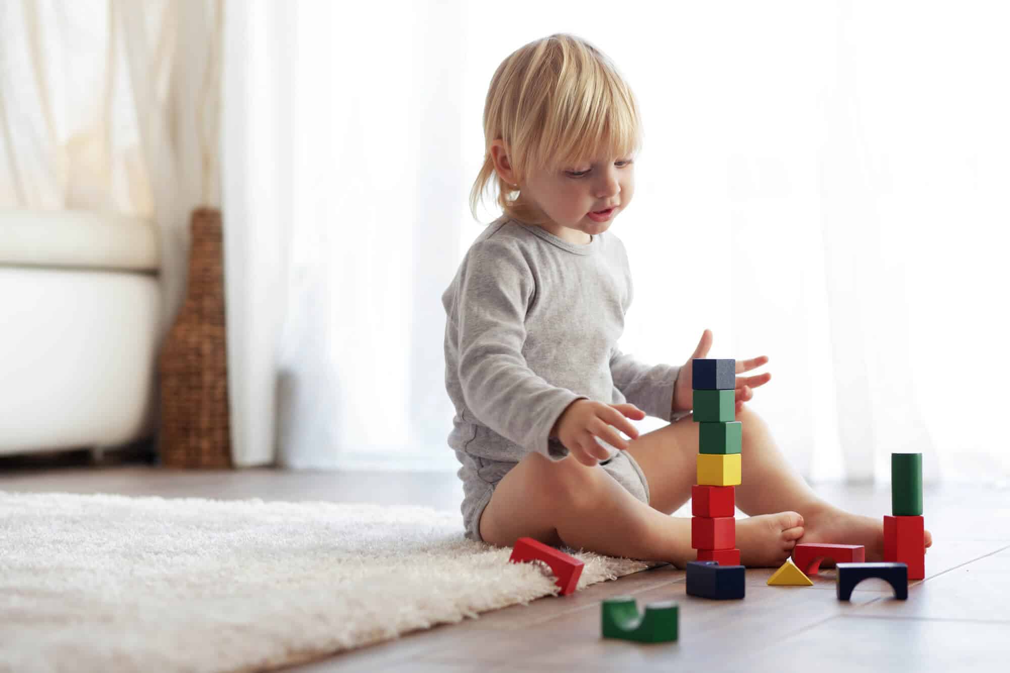 toddler playing blocks