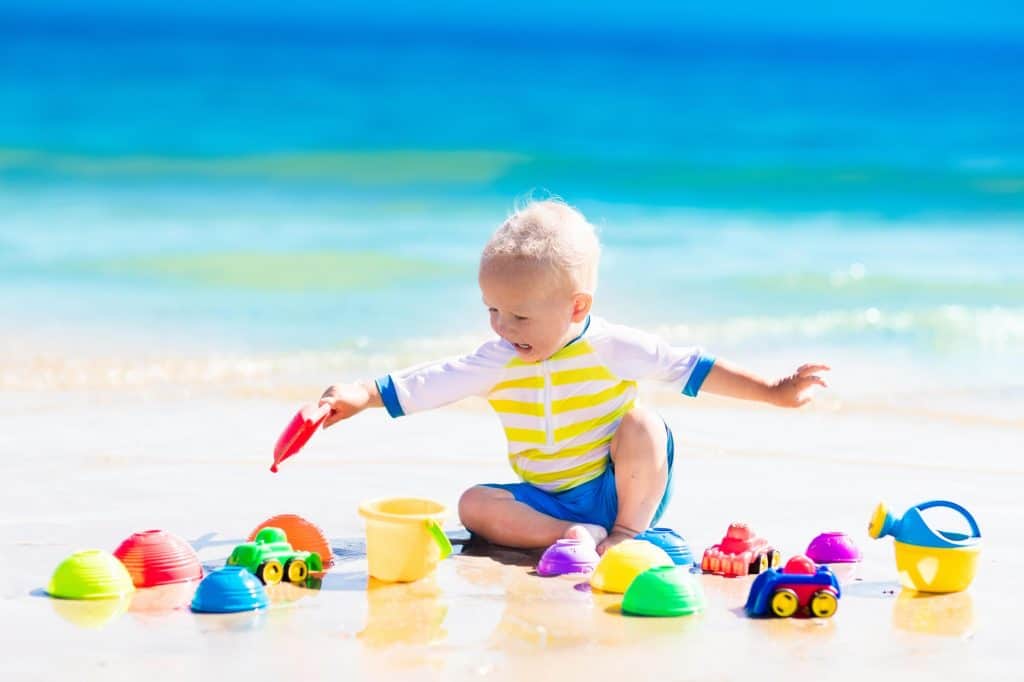 toddler playing beach