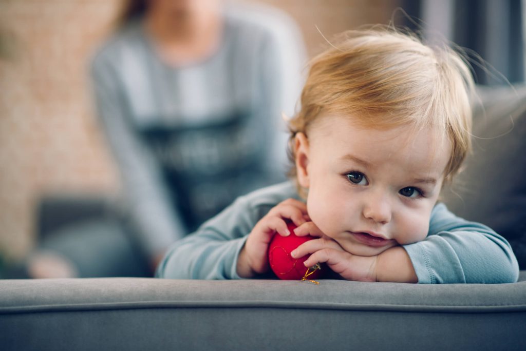 toddler holding a ball