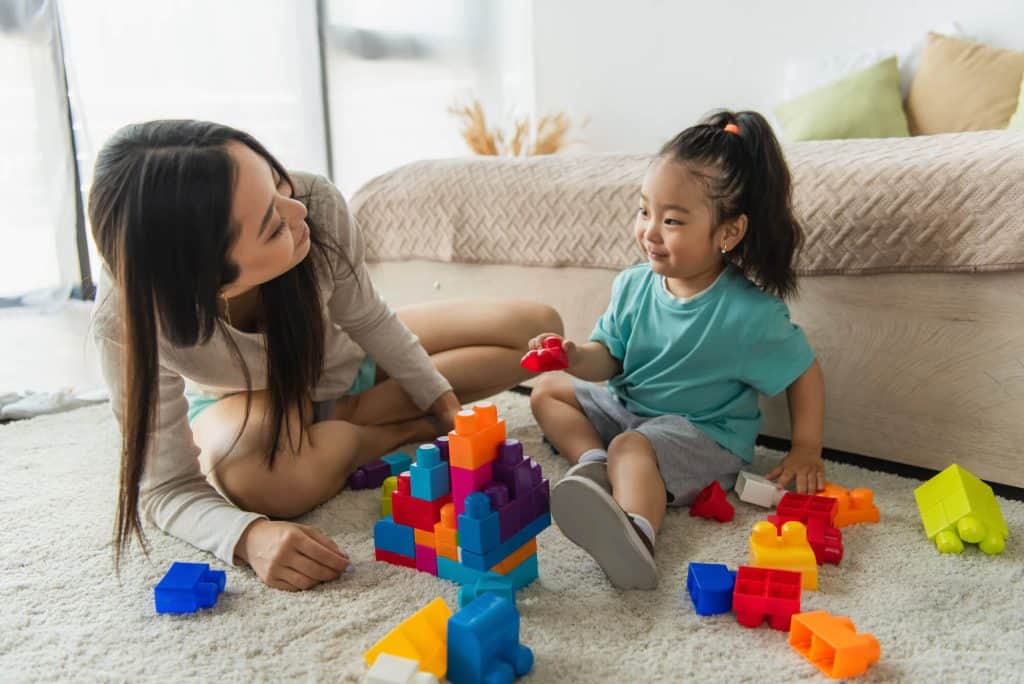 mom and toddler playing