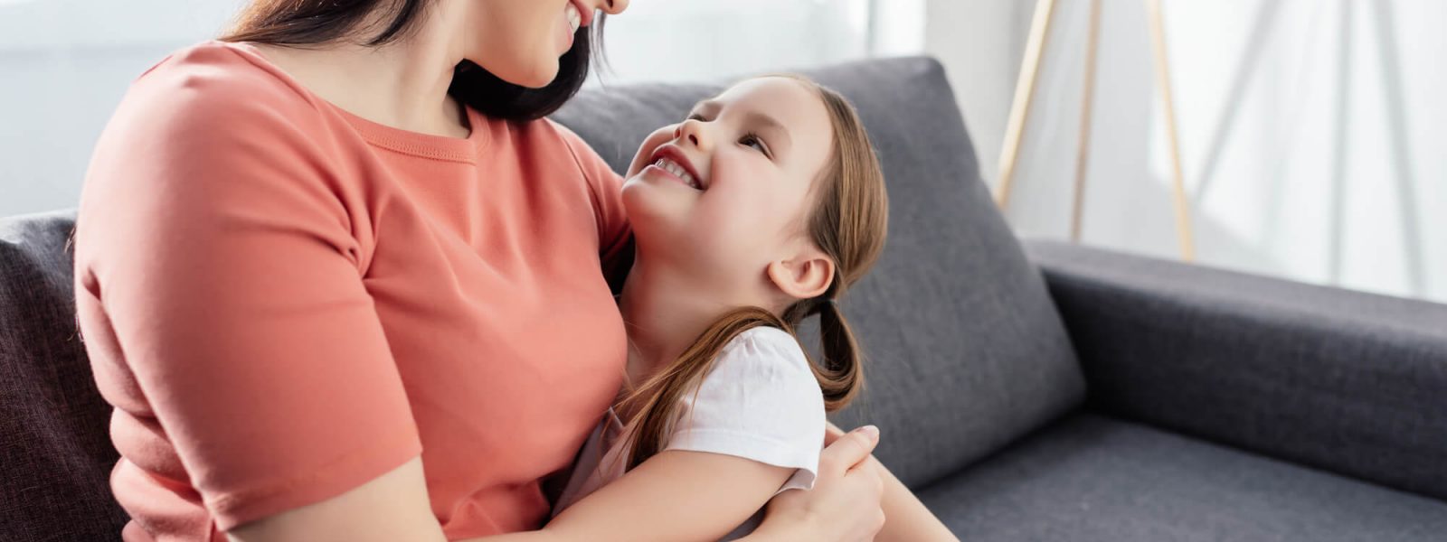 Parent calmly talking with child, illustrating patient parenting