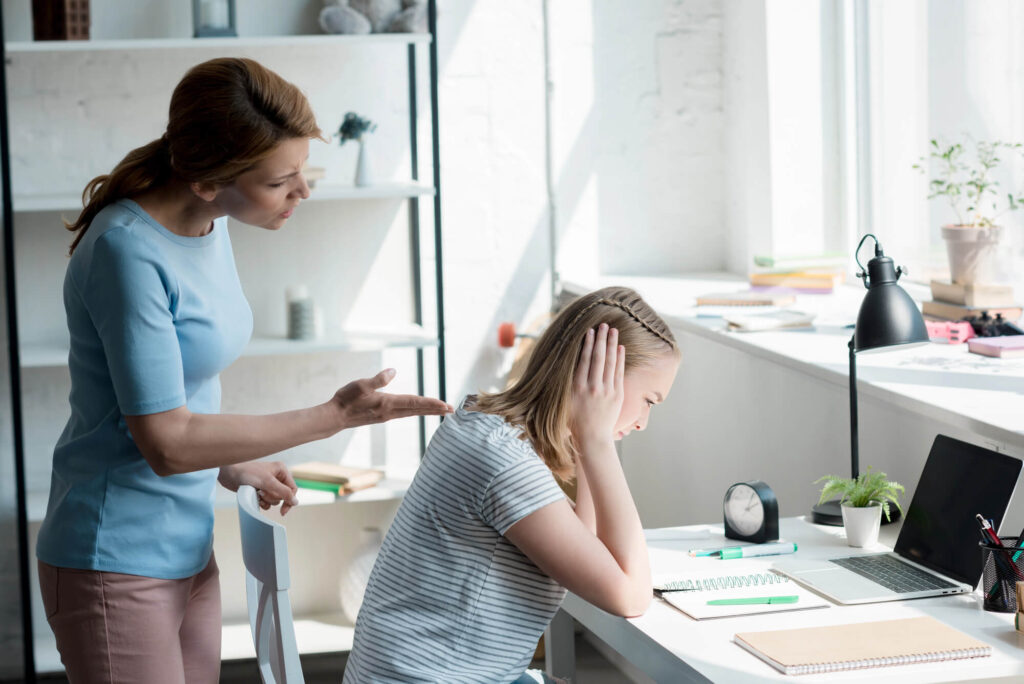 Frustrated parent yelling at upset child