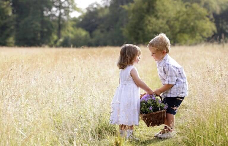 Young child playing near another child, learning to notice and understand others' emotions