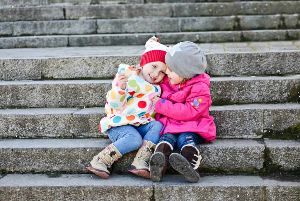 Toddler hugging another child — perspective taking and Theory of Mind in early child development