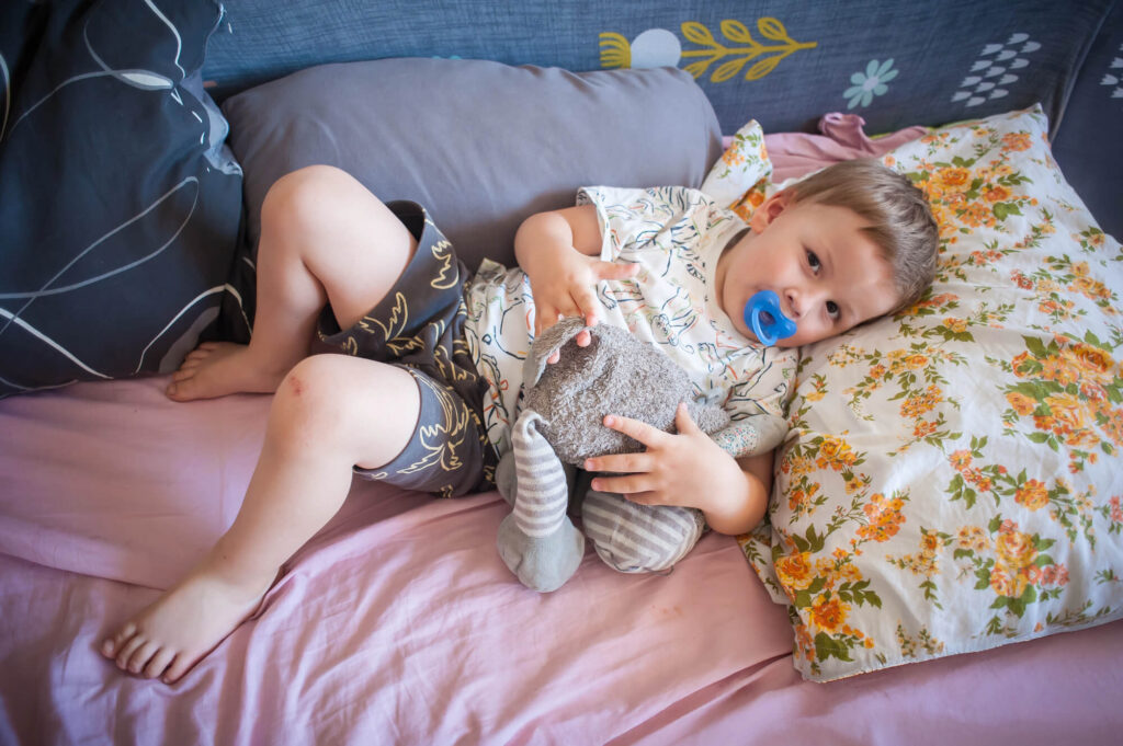child with a stuffed animal lovey showing an overlooked developmental milestone