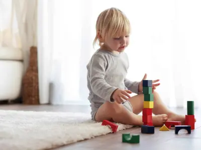 toddler playing blocks