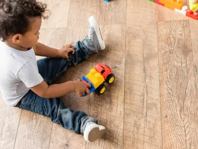 toddler playing with truck