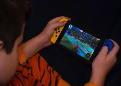boy playing video game why do kids love video games