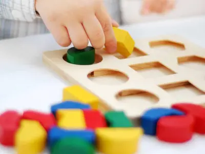 preschooler playing with blocks
