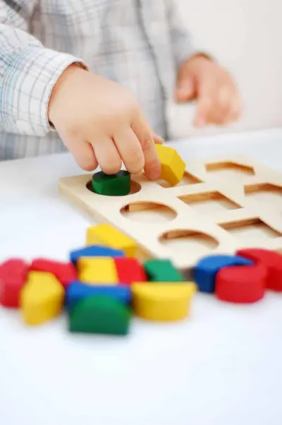 child with blocks preschooler playing with blocks