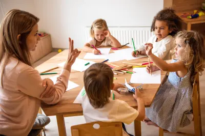 children and teacher students in kindergarten