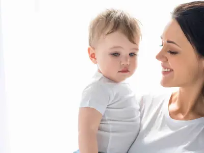 mom holding toddler