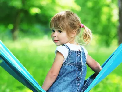 quiet girl sitting in a hammock