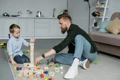 child father playing with toys child father playing