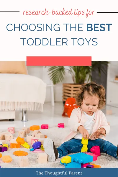 toddler girl playing with toys tips for choosing toddler toys