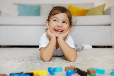 toddler playing with blocks toddler happy with toys