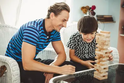 father and son playing a game father and son playing a game