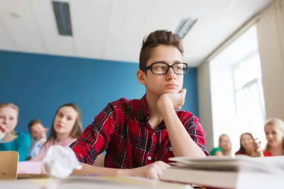 tween boy in classroom